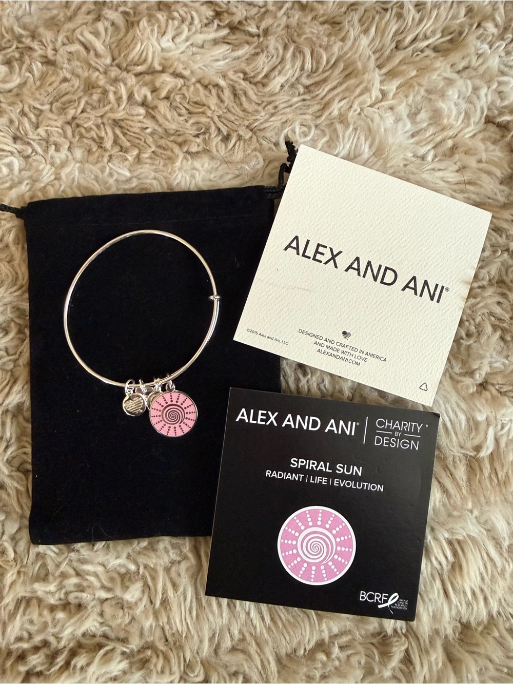 Alex and Ani Silver Bangle with Pink Spiral Sun Charm